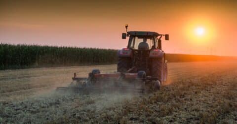 Tractor plowing field