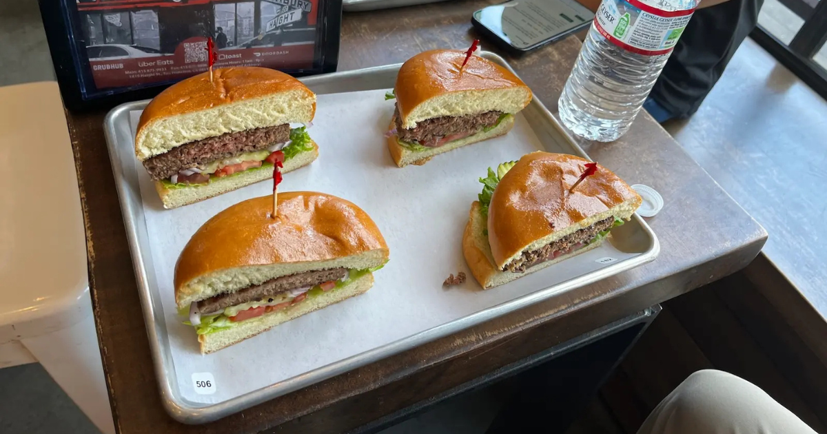 A spread of four plant-based burgers