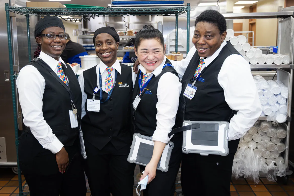 Food service associates smiling for a photo