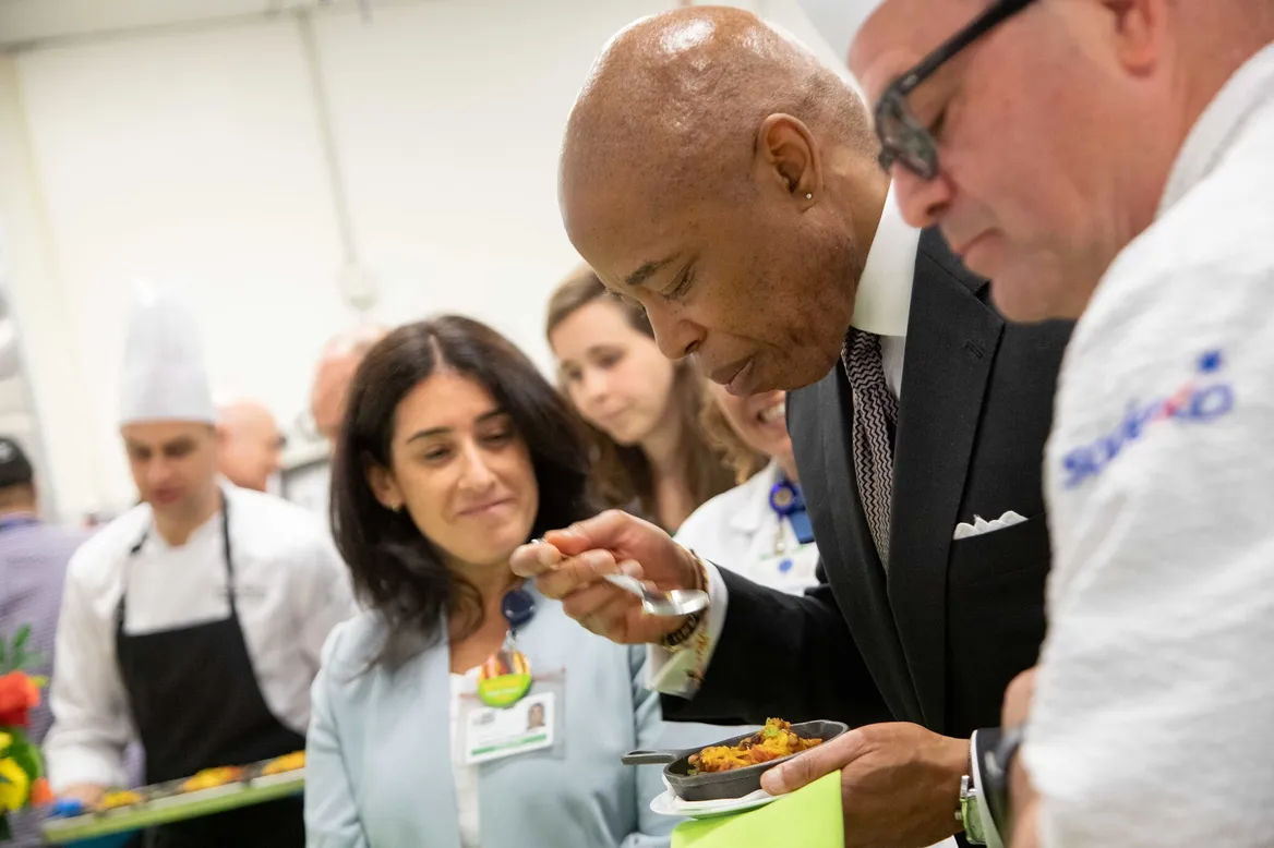 New York City Mayor Eric Adams samples a plant-based dish at the NYC Health + Hospitals Culinary Center